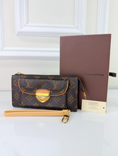 LOUIS VUITTON WALLET ASTRID / WRISTLET