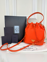 PRADA TESSUTO NYLON BUCKET CROSSBODY IN ORANGE