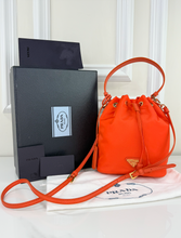 PRADA TESSUTO NYLON BUCKET CROSSBODY IN ORANGE