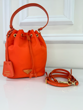 PRADA TESSUTO NYLON BUCKET CROSSBODY IN ORANGE