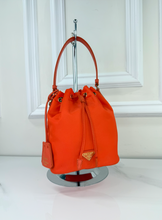 PRADA TESSUTO NYLON BUCKET CROSSBODY IN ORANGE