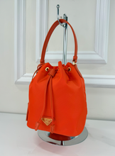 PRADA TESSUTO NYLON BUCKET CROSSBODY IN ORANGE