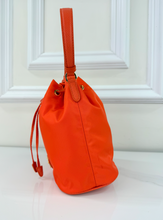 PRADA TESSUTO NYLON BUCKET CROSSBODY IN ORANGE