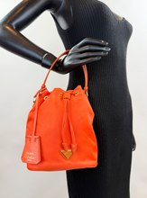 PRADA TESSUTO NYLON BUCKET CROSSBODY IN ORANGE