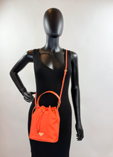 PRADA TESSUTO NYLON BUCKET CROSSBODY IN ORANGE