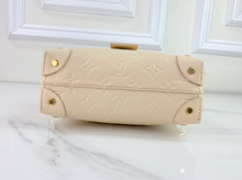LOUIS VUITTON PETITE MALLE SOUPLE EMPREINTE IN CREME
