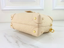 LOUIS VUITTON PETITE MALLE SOUPLE EMPREINTE IN CREME