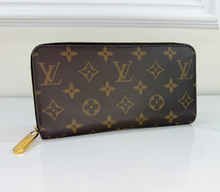 LOUIS VUITTON WALLET ZIPPY MONOGRAM FUCHSIA