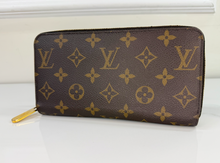 LOUIS VUITTON WALLET ZIPPY MONOGRAM FUCHSIA